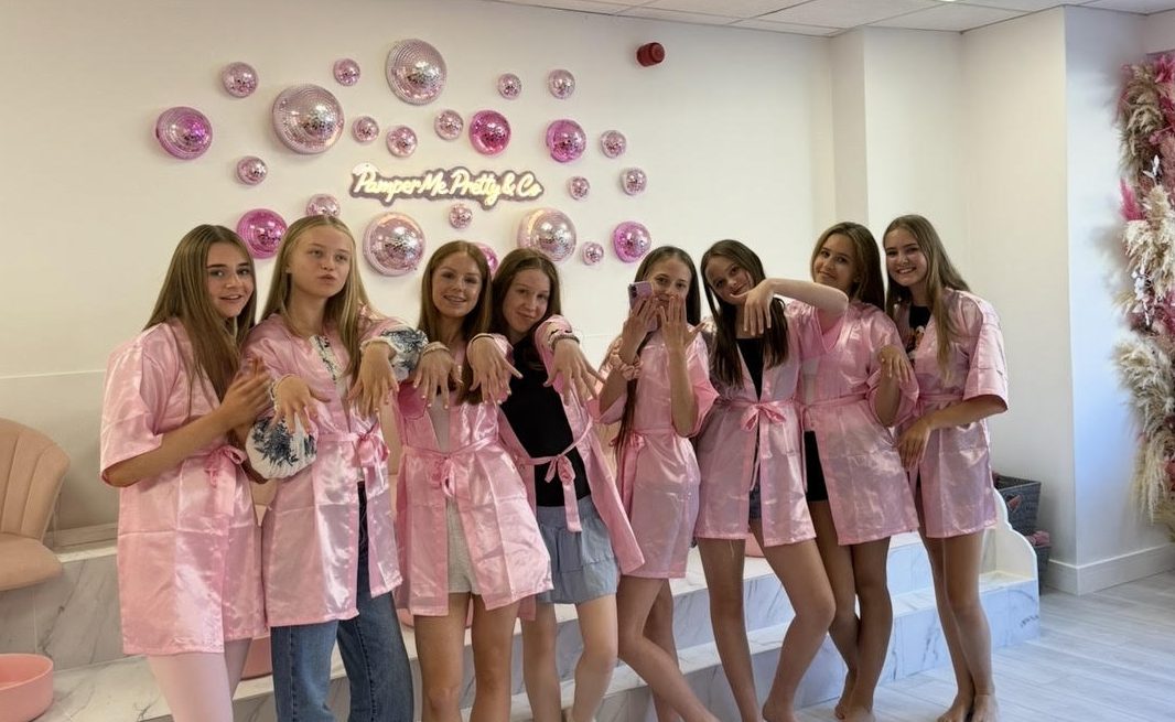 Group of children in matching pink robes at a Pamper Me Pretty party